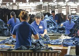 Many people making jeans